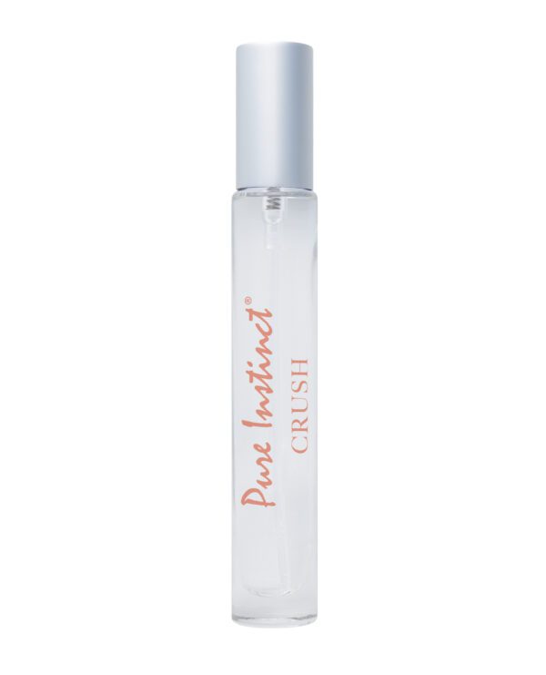 Clear glass roller bottle of Pure Instinct CRUSH perfume with a silver cap on a white background.