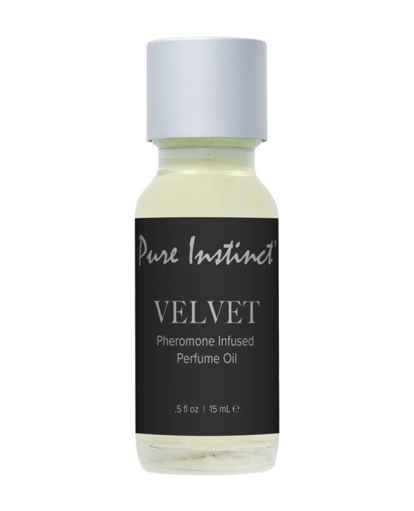 A bottle of Pure Instinct Velvet pheromone infused perfume oil with a clear label displaying the product name and volume.