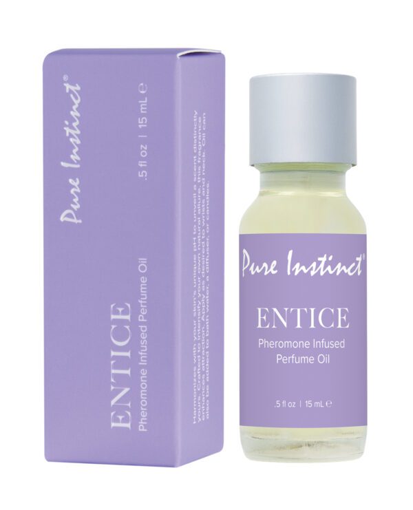 A bottle of Entice Pheromone Infused Perfume Oil next to its purple packaging box.