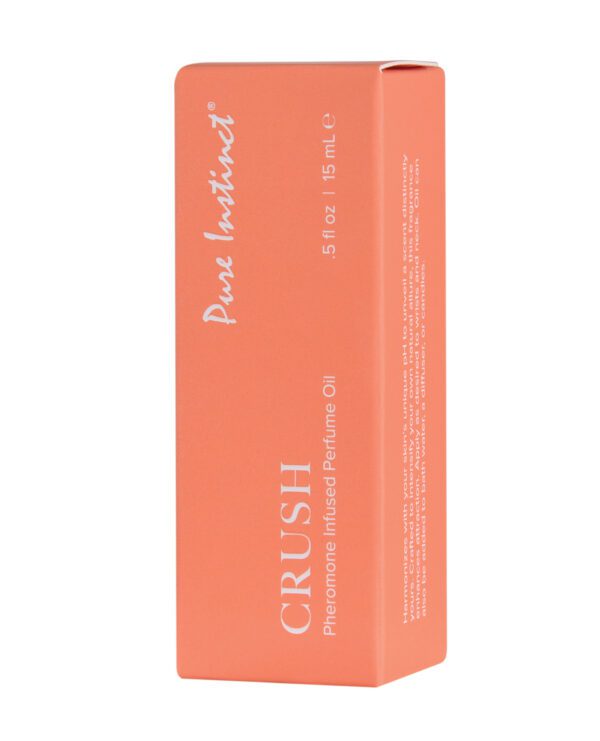 Orange box of Pure Instinct CRUSH Pheromone Infused Perfume Oil with product information