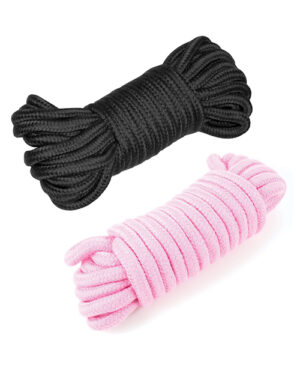 Two bundles of hair elastic bands, one in black and the other in light pink, arranged vertically on a white background.