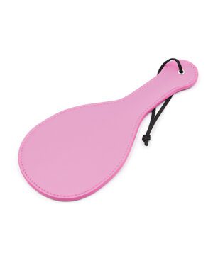 A pink paddle-shaped object with a black wrist strap on a white background.
