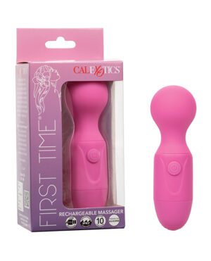 A pink "First Time Rechargeable Massager" by CalExotics, displayed next to its packaging, which includes branding and product information.