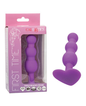 A purple triple beaded probe by CalExotics in its packaging, with a label "FIRST TIME" and the product displayed beside the box. The product features a silicone material and is intended for adult use.