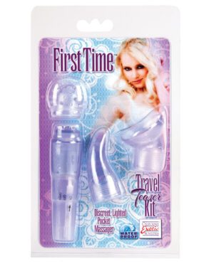 A product package titled "First Time Travel Teaser Kit" showing a clear plastic carrying case with various attachments and a pocket massager. The design includes an image of a woman and descriptive phrases such as "Discreet, Lighted" and "Water Proof."