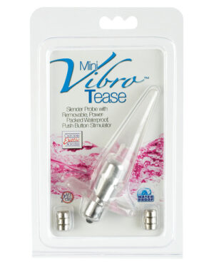 A slender, silver-colored Mini Vibro Tease device in plastic packaging, with text highlighting its features such as being a slender probe with removable power-packed waterproof push-button stimulator. Batteries are included in the package.
