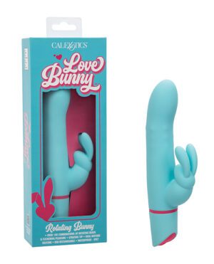 A turquoise personal massager in packaging with the text "Love Bunny" displayed alongside the product outside of the box.