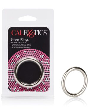A product packaging for a "CALEXOTICS Silver Ring," displayed with a medium-sized silver metal ring next to the packaging. The package has text indicating the ring size and properties such as "universal metal ring" and "strong and durable."