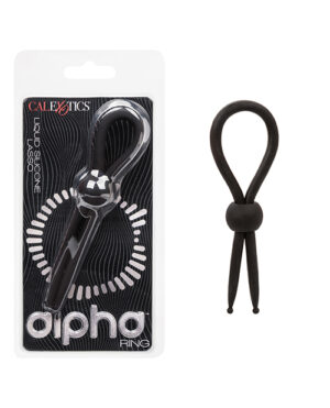 A black silicone ring designed to resemble scissors with looped handles, displayed on packaging labeled "CalExotics Liquid Silicone Alpha Ring."