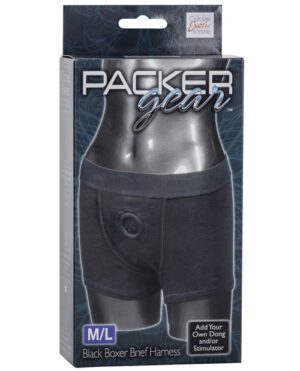 Alt text: "Packaging for a Packer Gear black boxer brief harness in size M/L, with text indicating the option to add your own dong and/or stimulator."