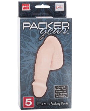 A product packaging for "PACKER GEAR™", featuring a 5"/12.75 cm prosthetic device, displayed in a box with text promoting its compatibility with harnesses.