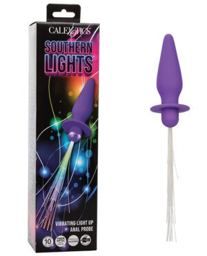 A product image featuring a purple vibrating anal probe next to its packaging, which is labeled "CalExotics Southern Lights Vibrating Light Up Anal Probe" with graphics depicting vibrant light beams and stars.