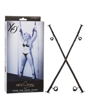 The image shows a package for an "Over the Door Cross" restraint system with a black and white picture of a model demonstrating the product, next to the actual black cross-shaped restraint accessory.