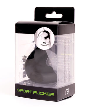 A silicone rugby ring by Sport Fucker, packaged in a clear plastic box with black and green branding.