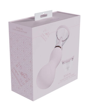 Product packaging for a sensual vulva and breast pump, with a clear window displaying the pump inside. The box is pink and white with text and a geometric design.