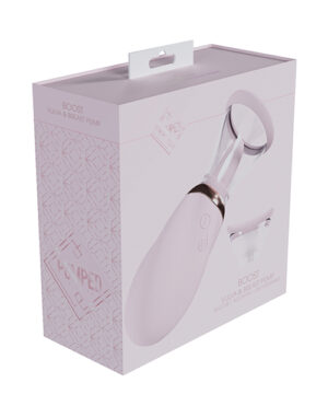 A pink and white product box for a BOOST Vulva and Breast Pump, with an image of the pump on the front.