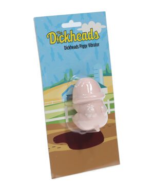 Packaging of "Dickheads Piggy Vibrator" with product visible in a clear plastic window, against a cartoon farm backdrop on the package.