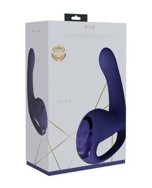 The image shows a product box for the VIVE RIKO "Best New Product" award-winning device, featuring a high-quality illustration of the purple, U-shaped, handheld massager with control buttons on the front. The packaging has a sleek design with geometric patterns and gold accents.