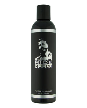 Ride Rocco Water-Based Lube::A sleek black bottle of Ride Rocco water-based lubricant, designed for comfort and smoothness, featuring a silhouette logo on the front.