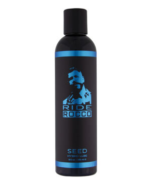 An 8.5 oz bottle of Ride Rocco hybrid lubricant featuring a sleek black design with blue accents and a stylized image of a man on the label.