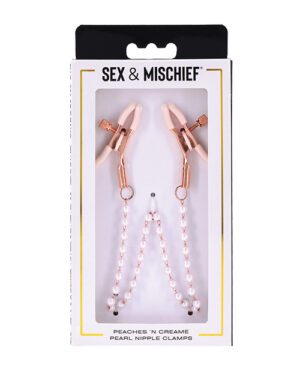 Alt text: Packaged nipple clamps with rose gold-colored clips and a strand of white beads connecting them, labeled "Peaches N' Creame Pearl Nipple Clamps" from the "SEX & MISCHIEF" brand.