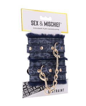 A pair of faux fur-covered handcuffs with a chain and key, packaged on a branded card.