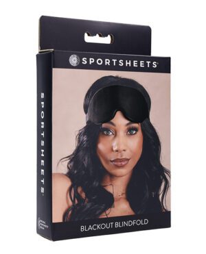 A sleek package featuring a model wearing a black blackout blindfold, highlighting the product's design and branding.