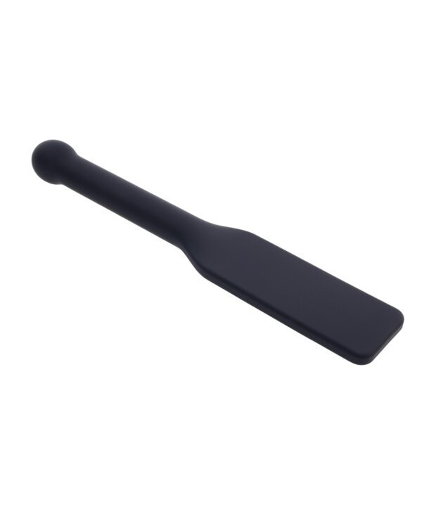 A black silicone spatula isolated on a white background