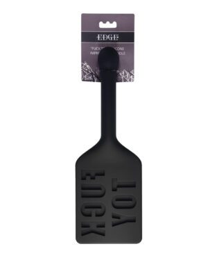 Black silicone paddle with word imprint, attached to a branded card with product description.