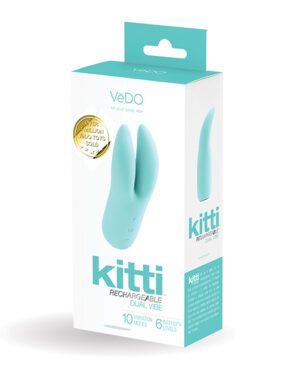 Alt text: A product packaging for a "VeDo Kitti Rechargeable Dual Vibe" device in turquoise and white colors, stating it has 10 vibration modes and 6 intensity levels. There is also a gold seal indicating "Over 1,500,000 Vedo Toys Sold."