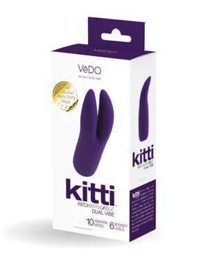 Product packaging for a purple "VeDo Kitti Rechargeable Dual Vibe" adult toy with the features "10 vibration modes" and "6 intensity levels" highlighted, along with a gold sticker stating "Over 1,000,000 VeDo Toys Sold."