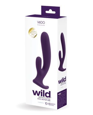 A product box for a VēDO Wild Rechargeable Dual Motor Vibe, predominantly white with purple accents, featuring an image of the purple product and descriptive text.
