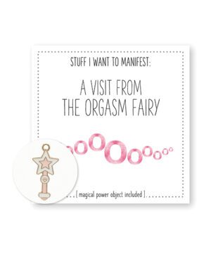 A card with the phrase "Stuff I want to manifest: A visit from the Orgasm Fairy" with a whimsical token featuring a star attached to circles.