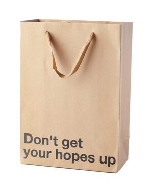 A plain brown paper bag with handles and the phrase "Don't get your hopes up" printed on it.