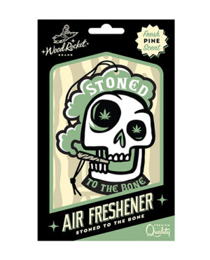 Packaging of an air freshener featuring a graphic of a skull with marijuana leaf eyes and the phrase "Stoned to the Bone," with a fresh pine scent label from the WoodRocket brand.