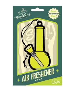 An air freshener packaging designed to look like a green bong, with a "Fresh Pineapple Scent" label and the WoodRocket brand logo at the top.