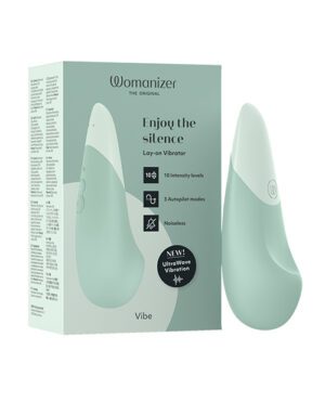 Womanizer brand vibrator and its packaging highlighting features such as intensity levels, autopilot modes, and noiseless operation.