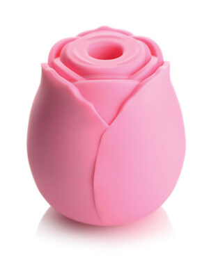 Silicone Rose Design::A pink silicone item shaped like a rose, featuring a hollow center and petal-like edges.