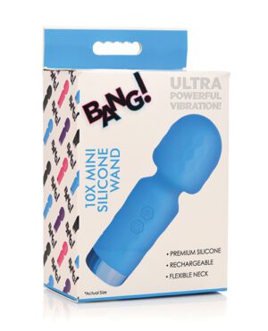 Product packaging for a "BANG! 10X Mini Silicone Wand" with the features "Ultra Powerful Vibration!," "Premium Silicone," "Rechargeable," and "Flexible Neck" listed. The packaging shows an image of a blue handheld massaging device with a flexible neck, and the phrase "Actual Size" indicating the size of the product. The background includes multiple silhouette images of the product in various colors.