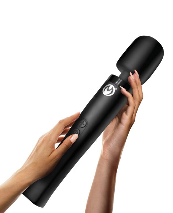 Hands holding a sleek black handheld microphone against a white background