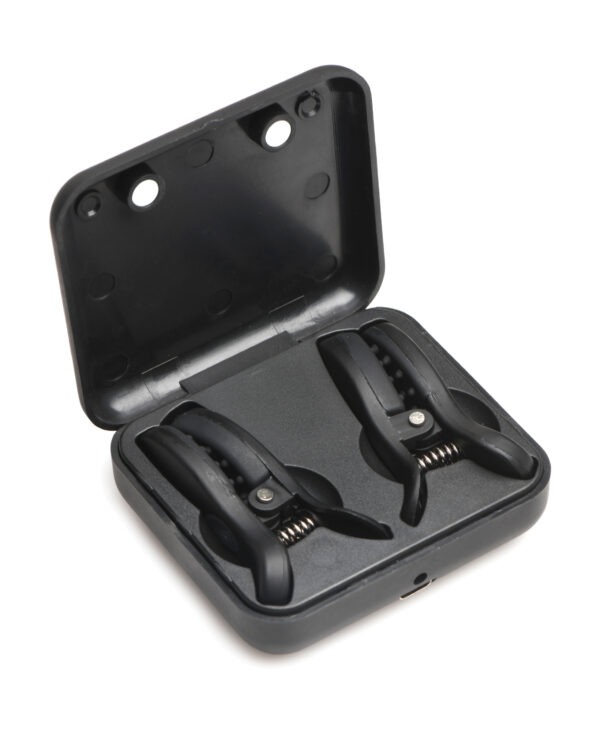 A compact black case containing two black clamps, showcasing their spring mechanism and design.