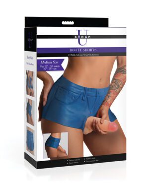 This is a product packaging image for blue "Booty Shorts" in medium size, featuring a torso of a person modeling the shorts with a hand on their hip, against a white background. The package lists the shorts' features and has additional product images on the side.