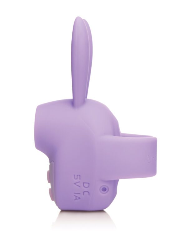 A purple silicone stand shaped like a rabbit with a slot for holding a phone, isolated on a white background.