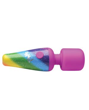 An image of a colorful tube of toothpaste with a purple cap, lying on its side.