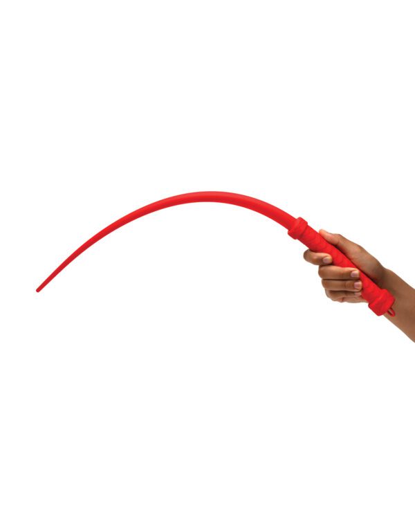 A person's hands bending a flexible red stick against a white background.