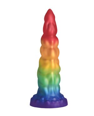 A multicolored toy rocket with a gradient from red at the top to blue at the base, isolated on a white background.